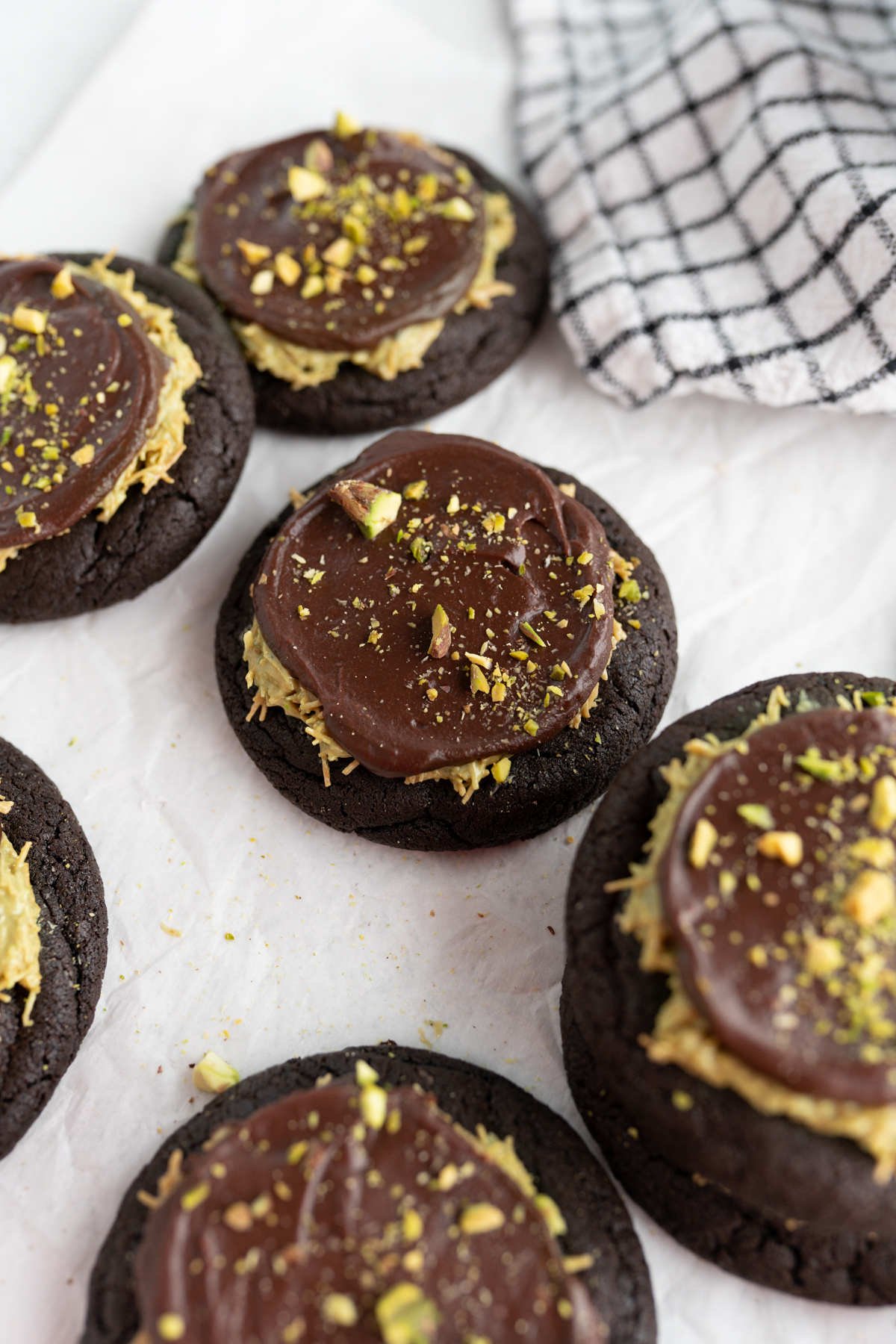 Dubai cookies with a chocolate base, pistachio topping and chocolate ganache. 