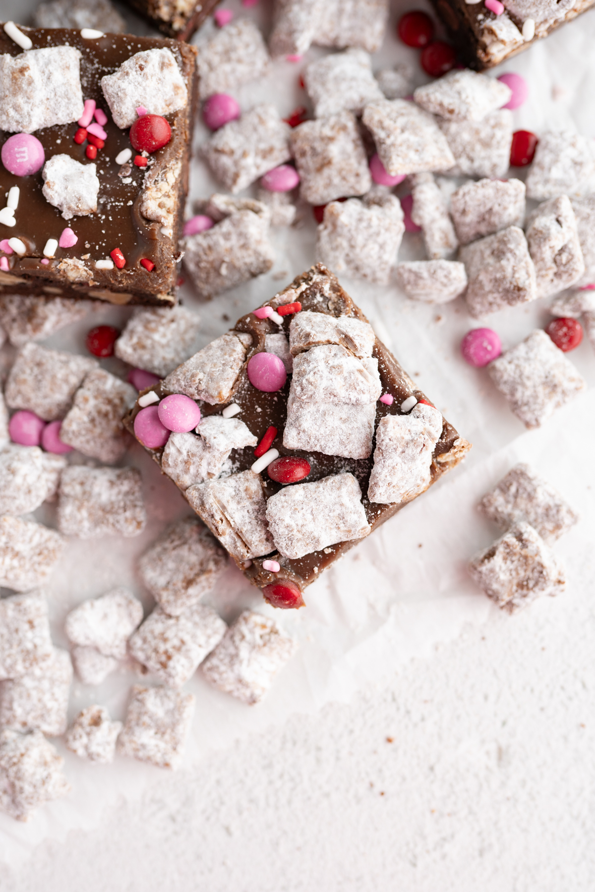 Aerial view of a valentines cookie bar inspired by puppy chow. 