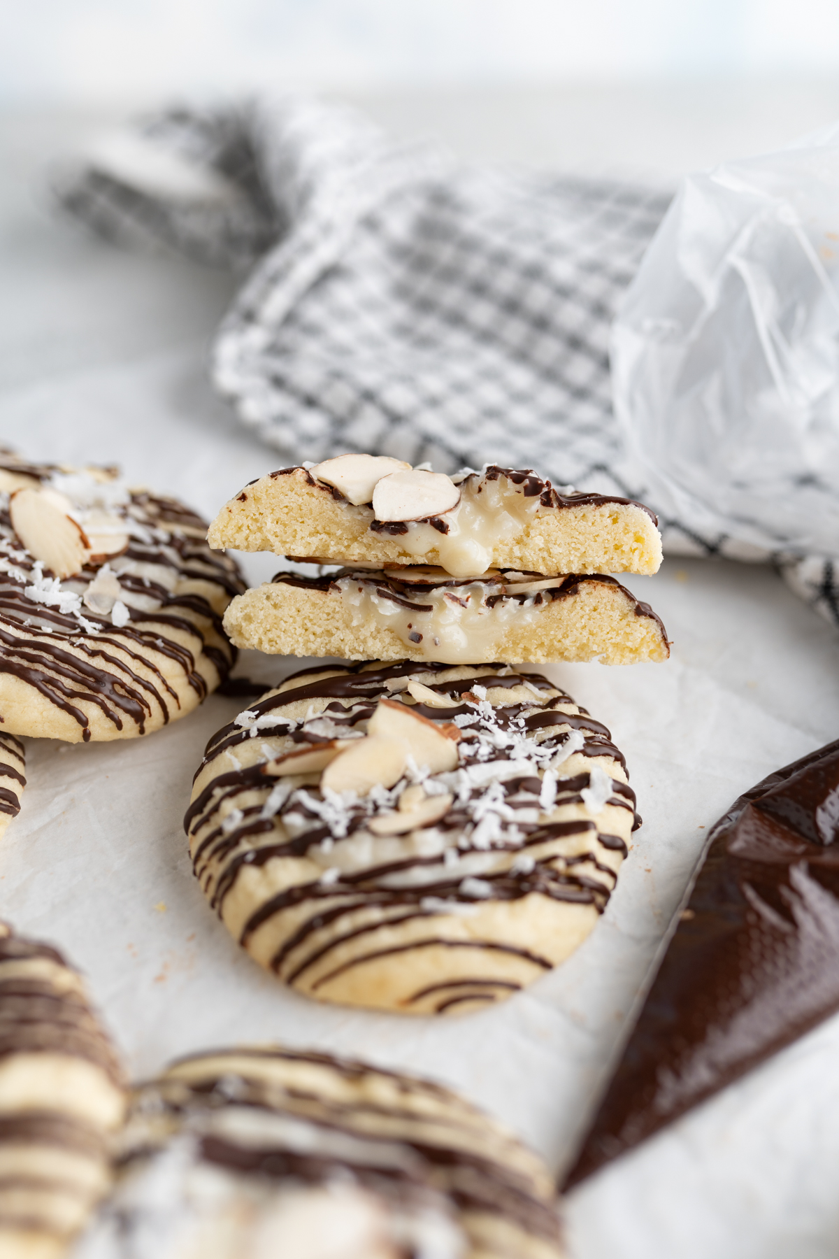 A coconut sugar cookie with almond joy filling cut in half. 