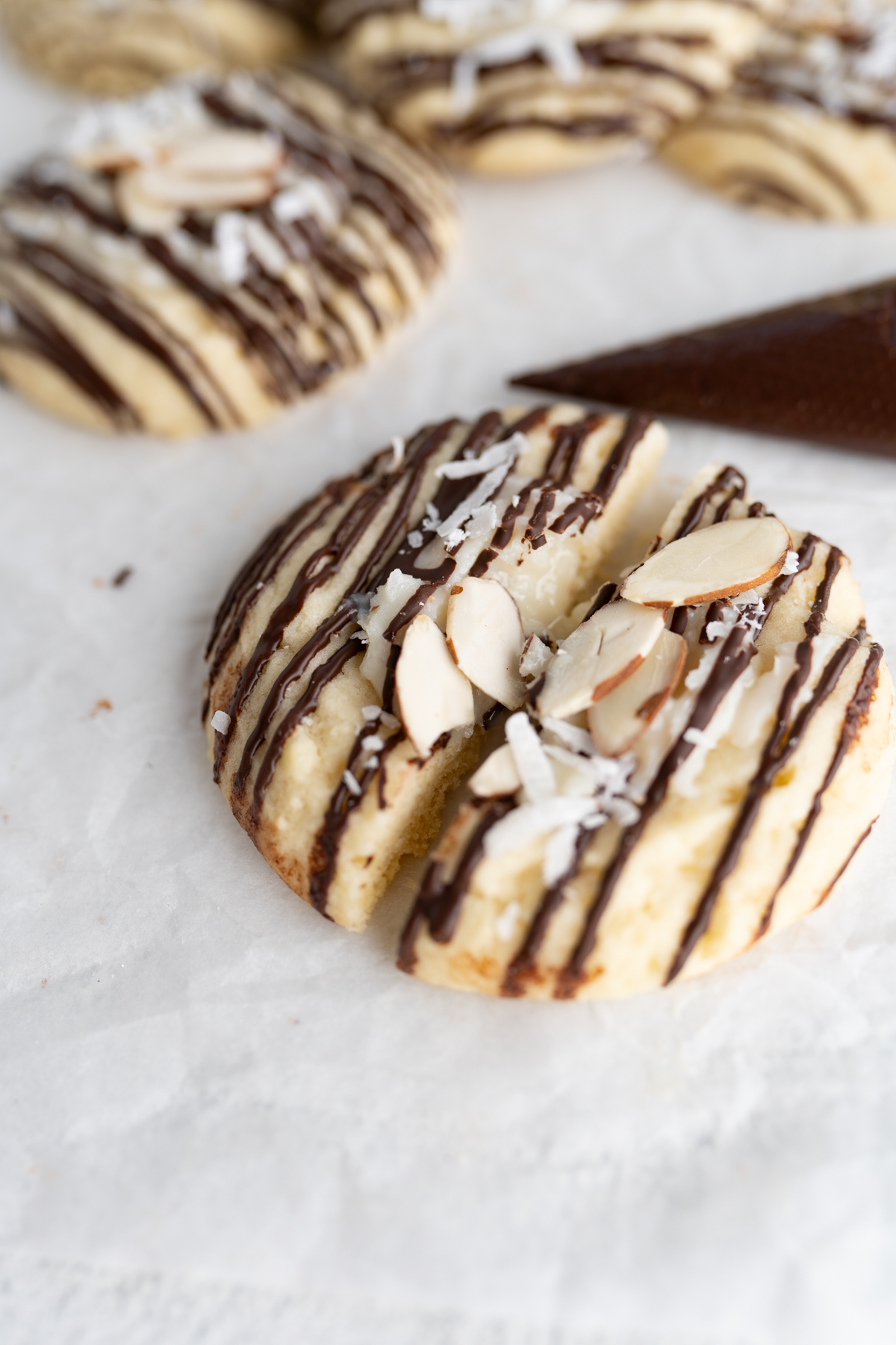 close up of a coconut sugar cookie with almond joy filling. 
