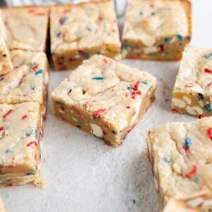 A cake batter blondie with red, white, and blue sprinkles.