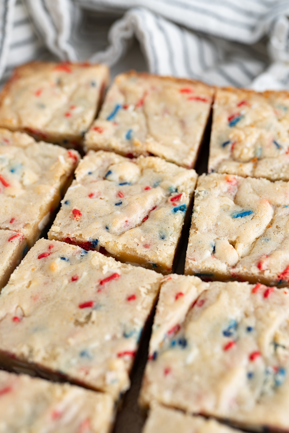Side view of a pan of patriotic cake batter blondies. 