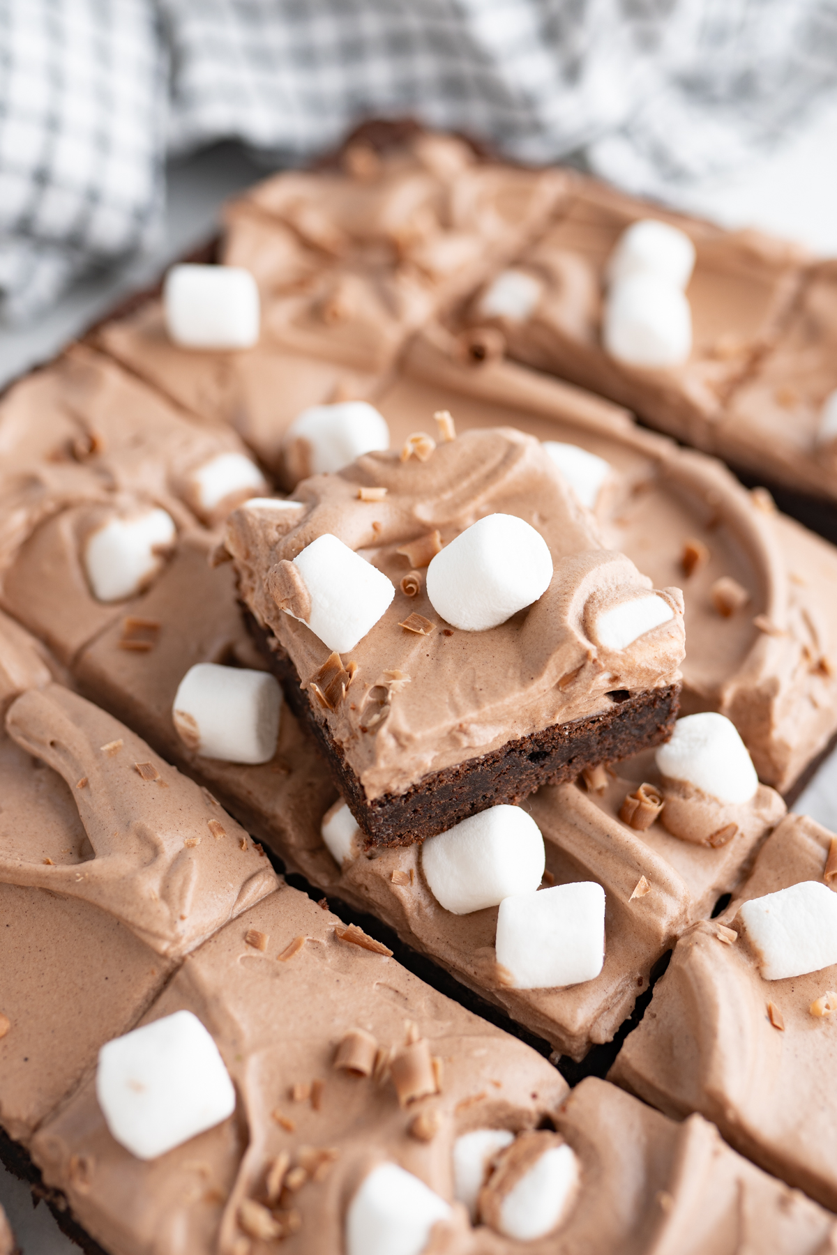 A hot cocoa bar topped with hot cocoa mousse and mini marshmallows. 