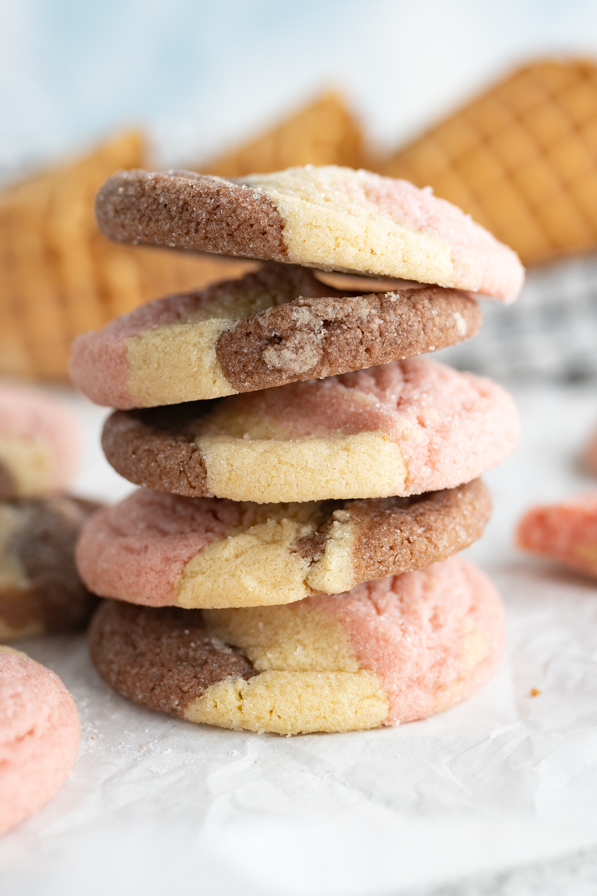 Side view of a stack of neapolitan cookies. 