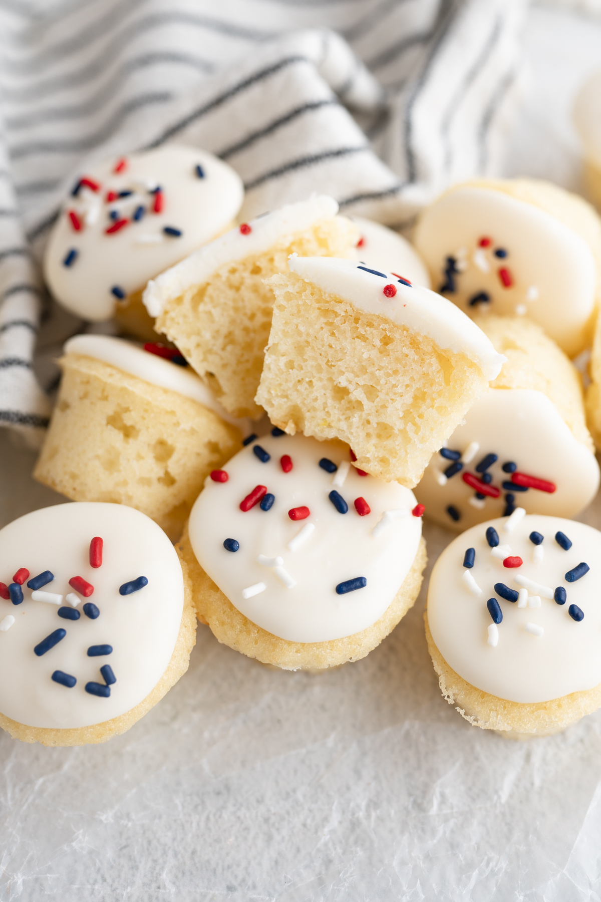 A pile of vanilla cake pops with american sprinkles. 