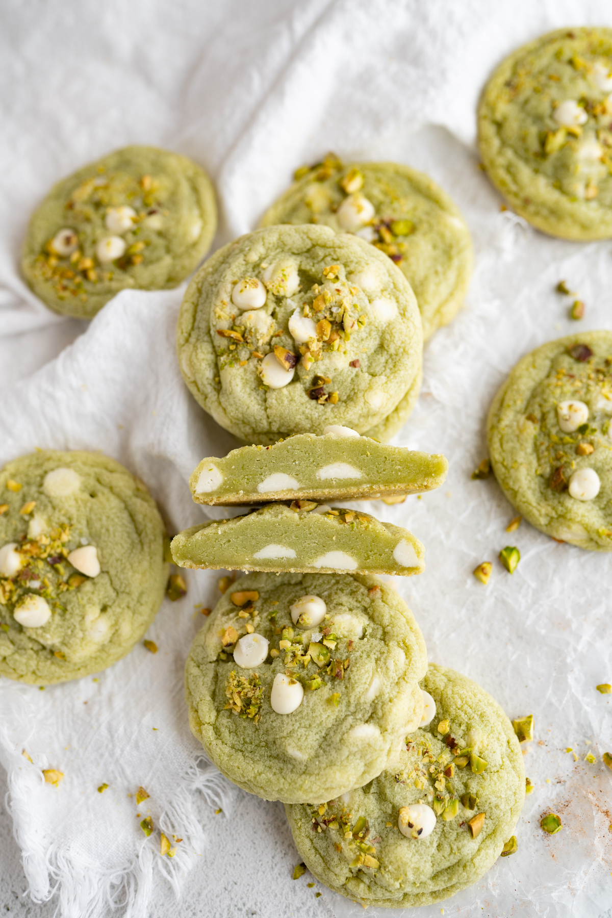 A pistachio cookie cut in half to review the soft interior. 