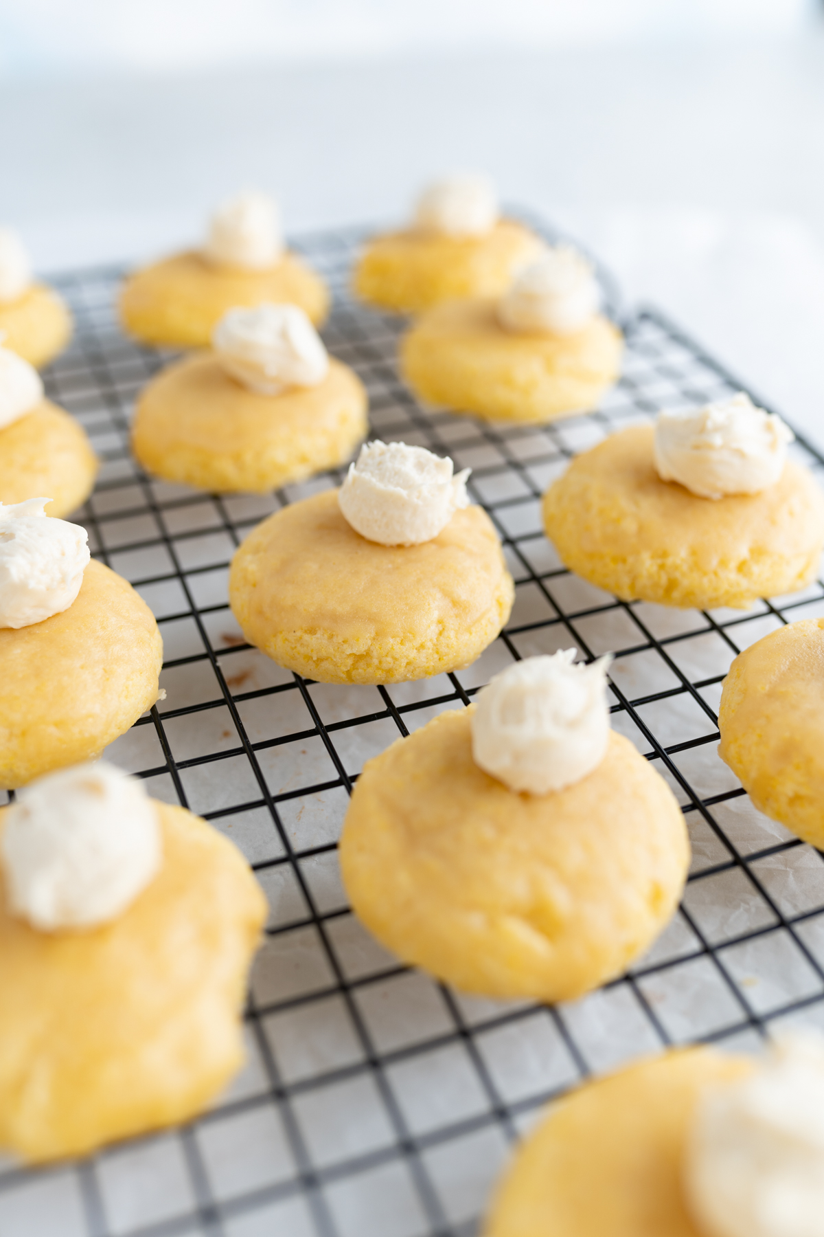 Mini cornbread cookies on a wire cooling rack. 