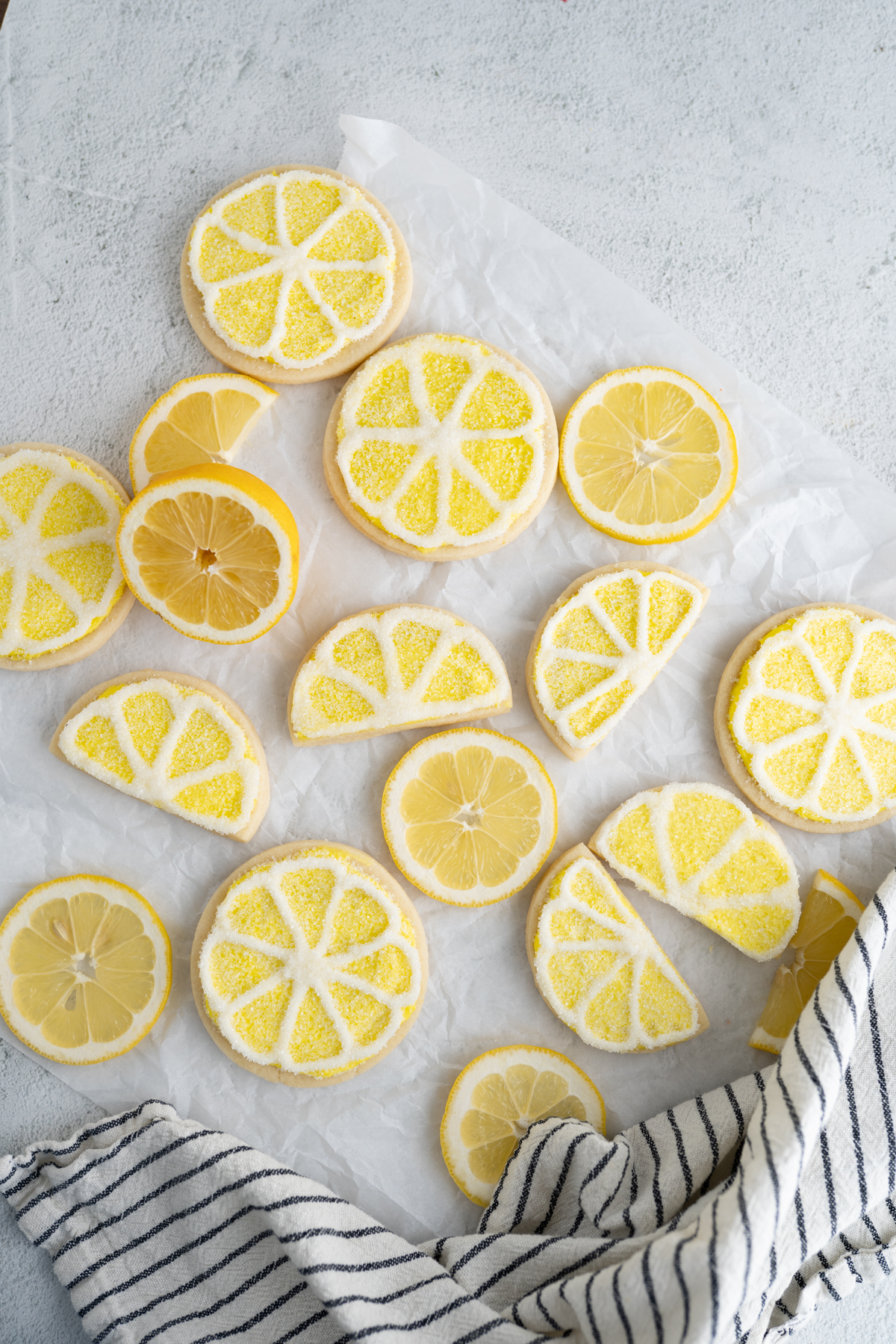 Frosted lemon sugar cookies on the counter. 