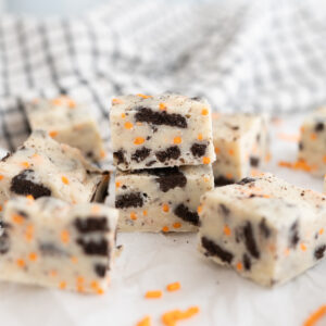 Squares of cookies and cream fudge with halloween sprinkles.