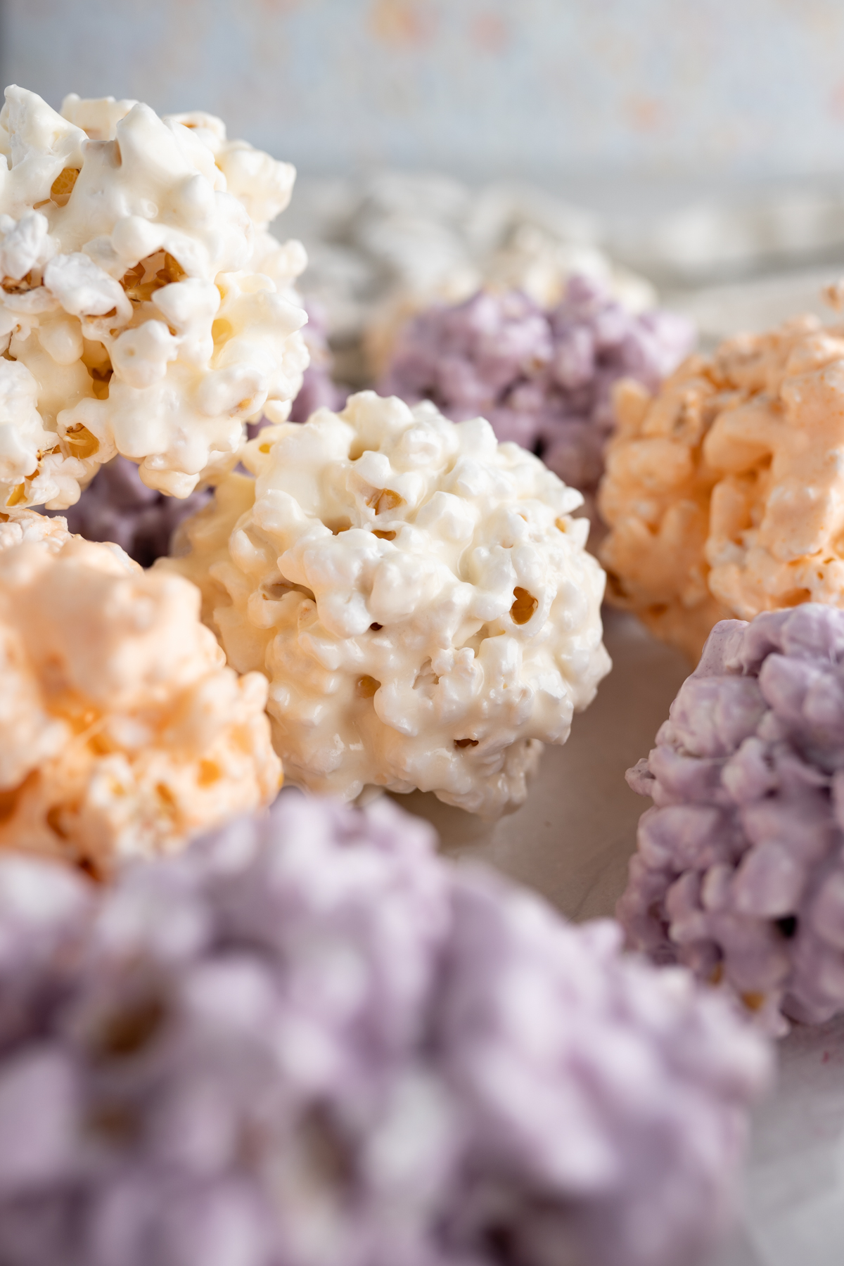 Close up of popcorn balls colored for halloween. 