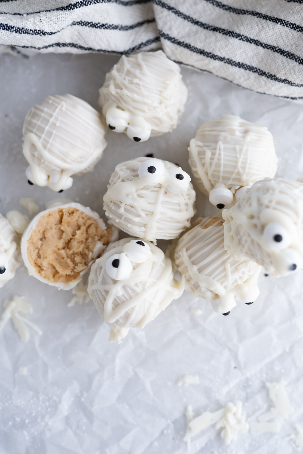 a pile of halloween themed golden oreo truffles 