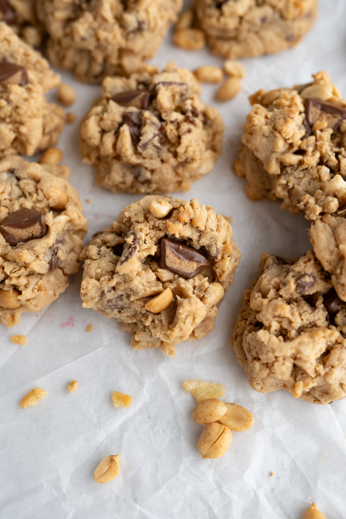 oatmeal peanut butter cookie with peanuts and peanut butter cups inside. 